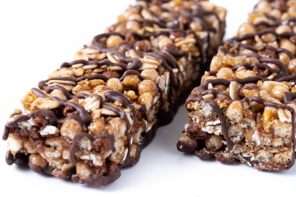 healthy-muesli-bars-with-nuts-black-chocolate-isolated-white-background (1).jpg